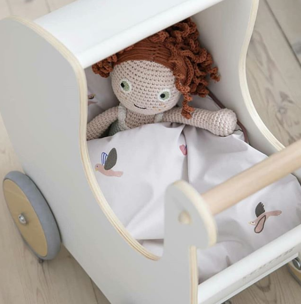 white wooden pram